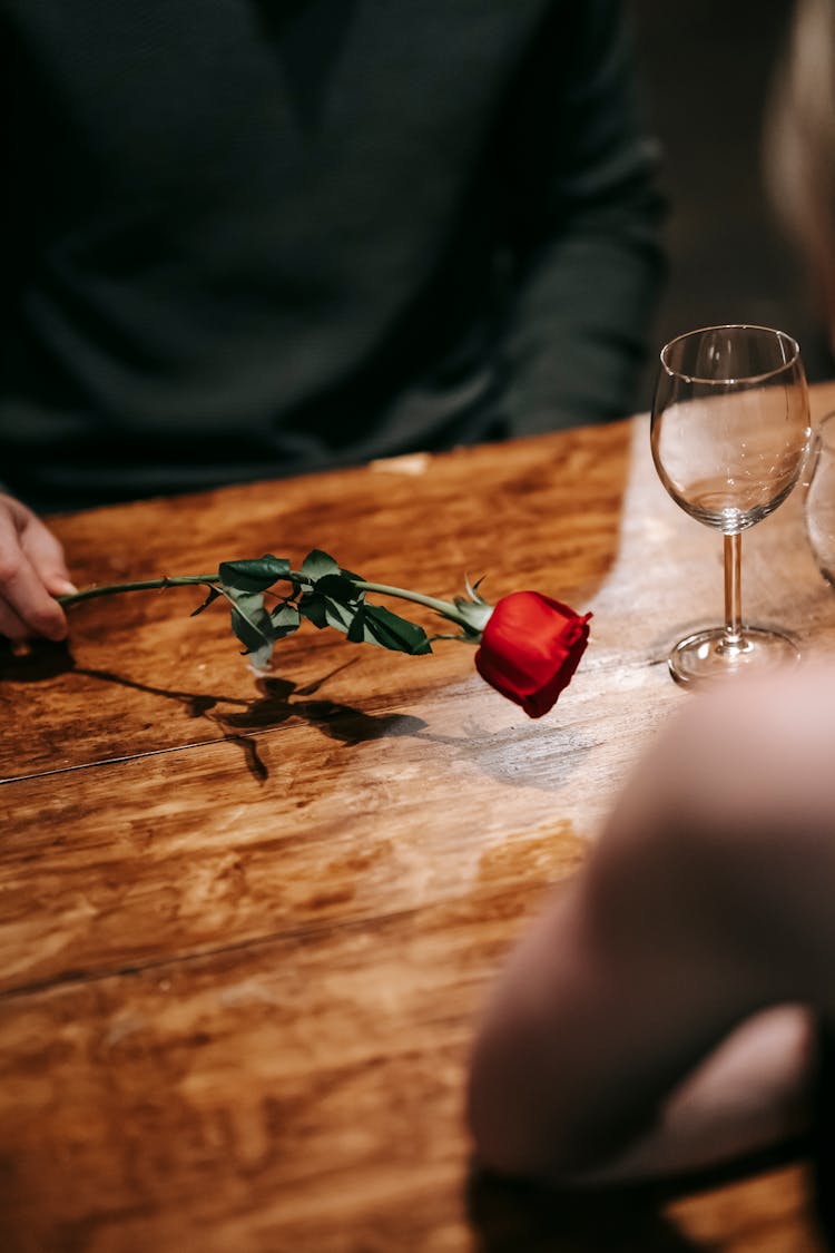 Anonymous Couple Having Romantic Dinner In Cafe