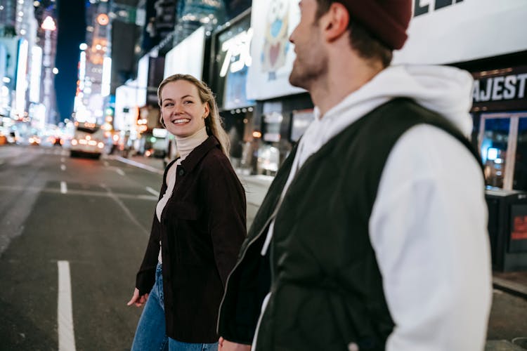 Positive Couple Walking On Road