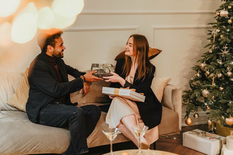 Man And Woman Exchanging Gifts