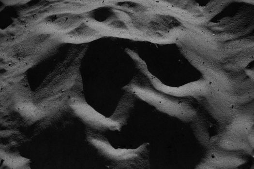 Sandy dunes in arid desert terrain