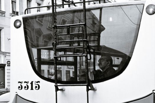 Elderly man with people in trolleybus