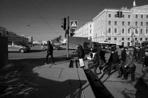 Free Black and white of crowd of people walking on urban street with buildings in daytime Stock Photo