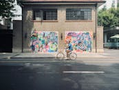 A Man Riding a Bicycle on the Road