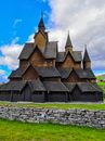 Brown and Black Concrete Church Under Blue Sky