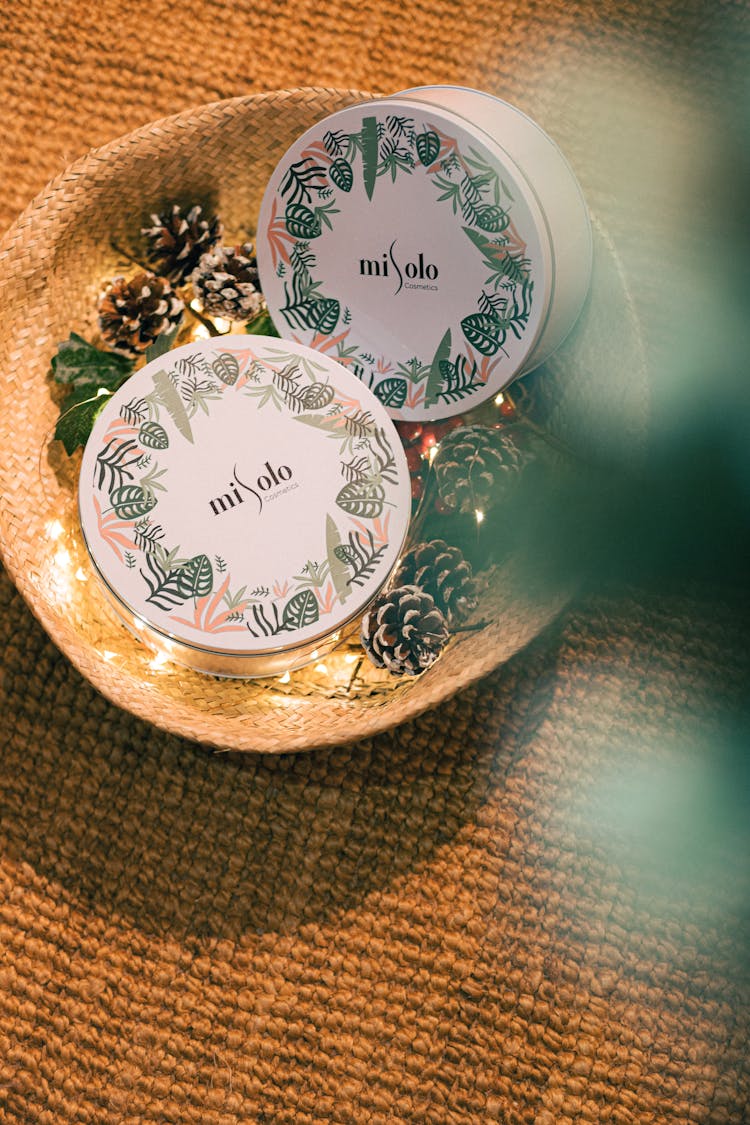 Candle Jars Lying In Decorative Bowl