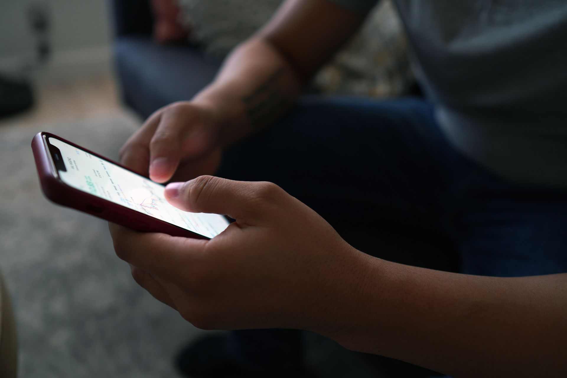 Close-Up Shot of a Person Holding a Cellphone