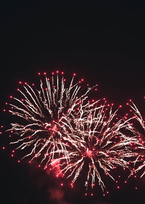 Red Fireworks in the Sky during Night TIme