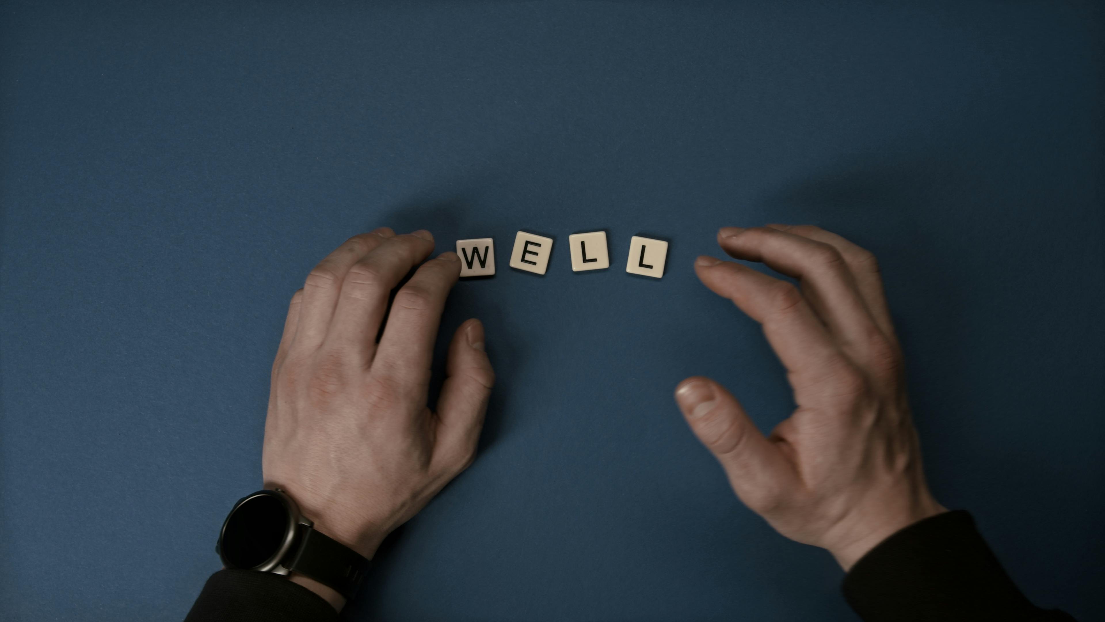 hands near letter tiles