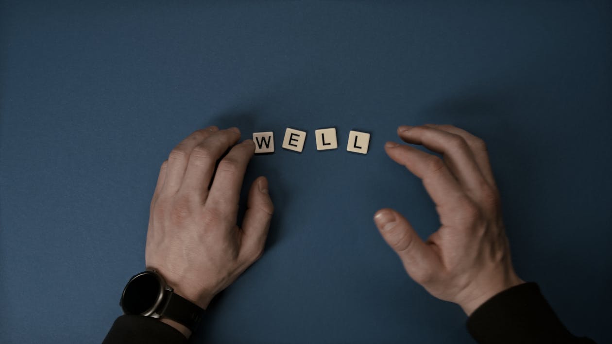 Hands Near Letter Tiles