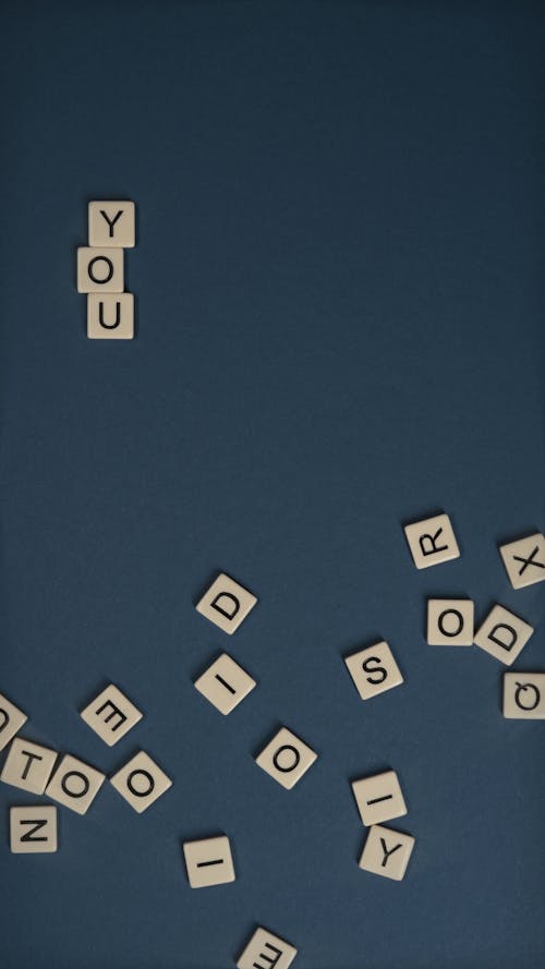 Free Scrabble Tiles on Flat Surface Stock Photo