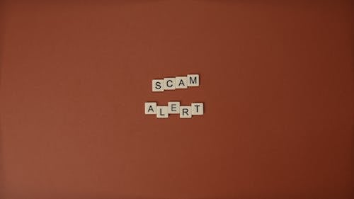 Free Close-Up Shot of Text on a Brown Surface Stock Photo