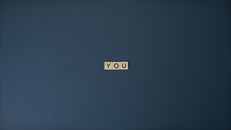 Close-Up Shot of Text on a Blue Surface