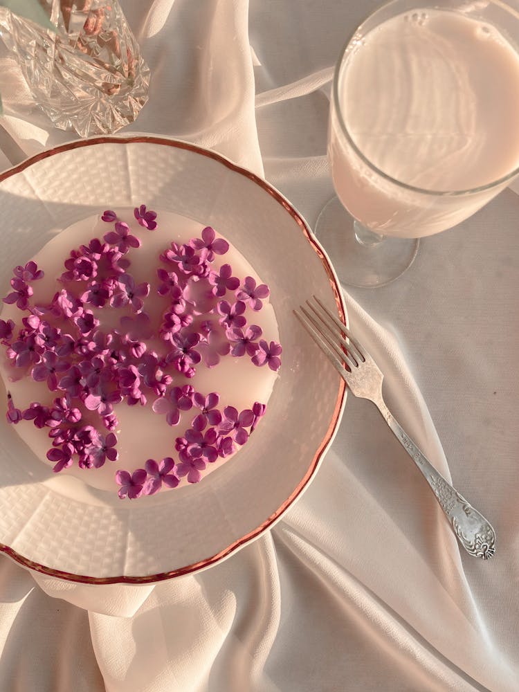 Dessert With Purple Flowers On Plate