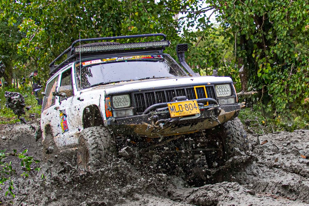 Off-road vehicle stuck in mud during overlanding recovery