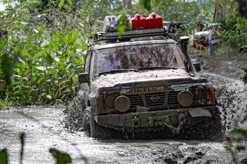 Free A Nissan Patrol Driving on the Mud Stock Photo