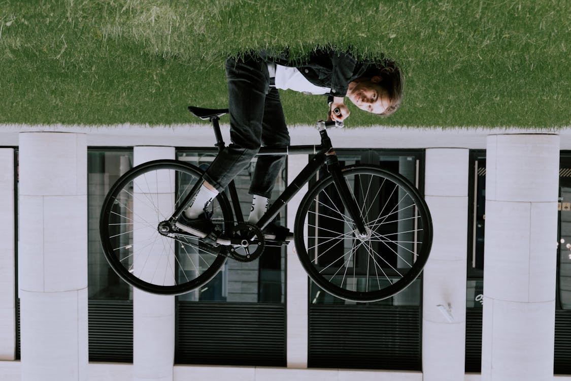 A Person Riding Bicycle Upside Down