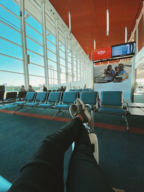 Free Man waiting for flight in airport Stock Photo