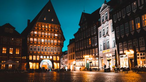 Free Beautifully illuminated evening scene in Hildesheim, Germany showcasing historical architecture. Stock Photo