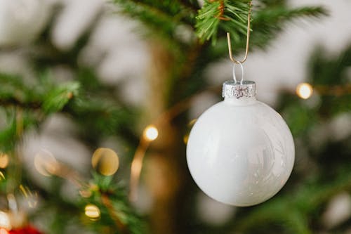 Close-up of a White Bauble on a Christmas Tree