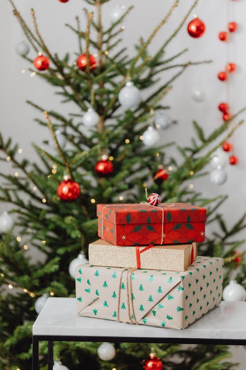 Free Christmas Presents and a Tree with Ornaments  Stock Photo
