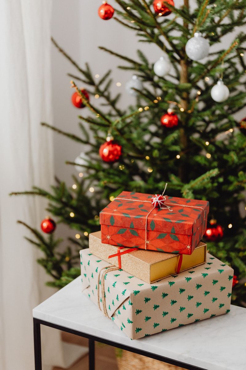Wrapped Christmas presents displayed on a white table