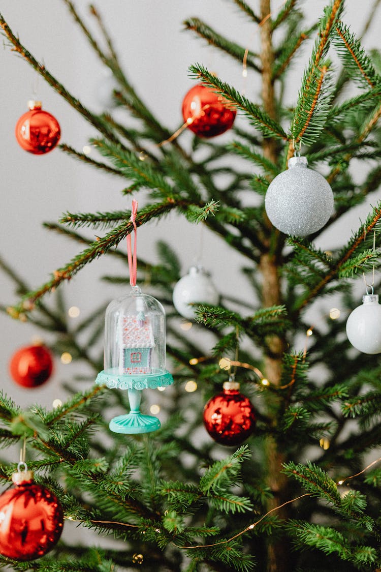 House Shaped Ornament Hanging From Christmas Tree