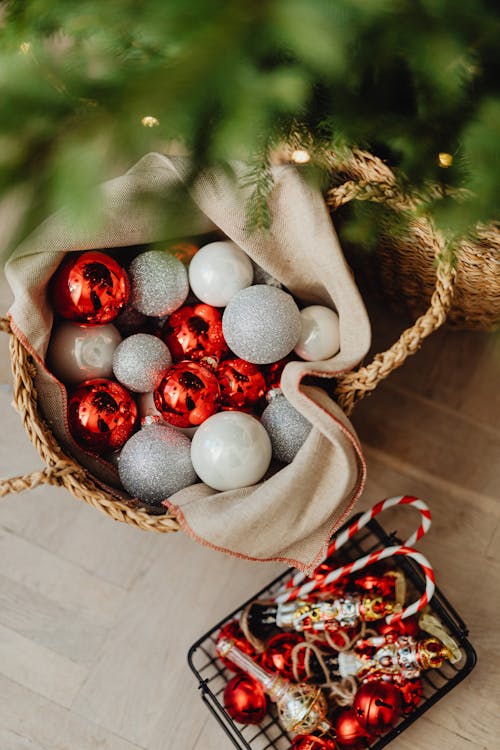 Christmas Baubles in a Basket Under a Christmas Tree