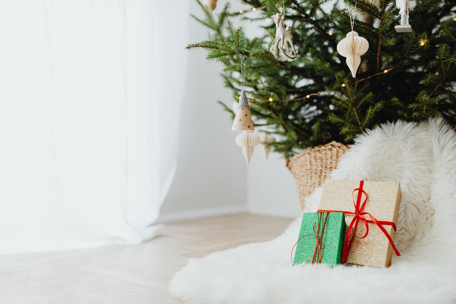 personalized home decor gifts - A beautifully decorated Christmas tree with wrapped gifts and cozy decor, perfect for the holiday season.