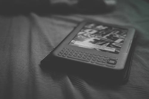 Grayscale Photo of E-reader