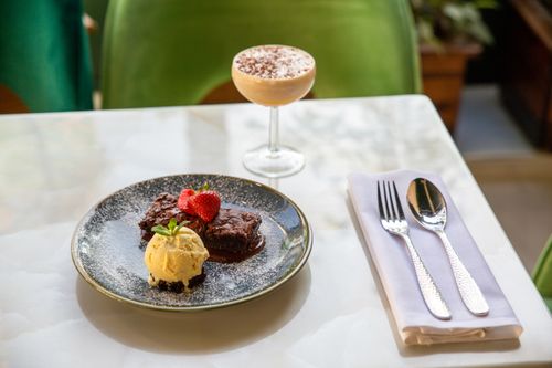 Free Indulge in homemade chocolate brownies with strawberries and vanilla ice cream. Stock Photo