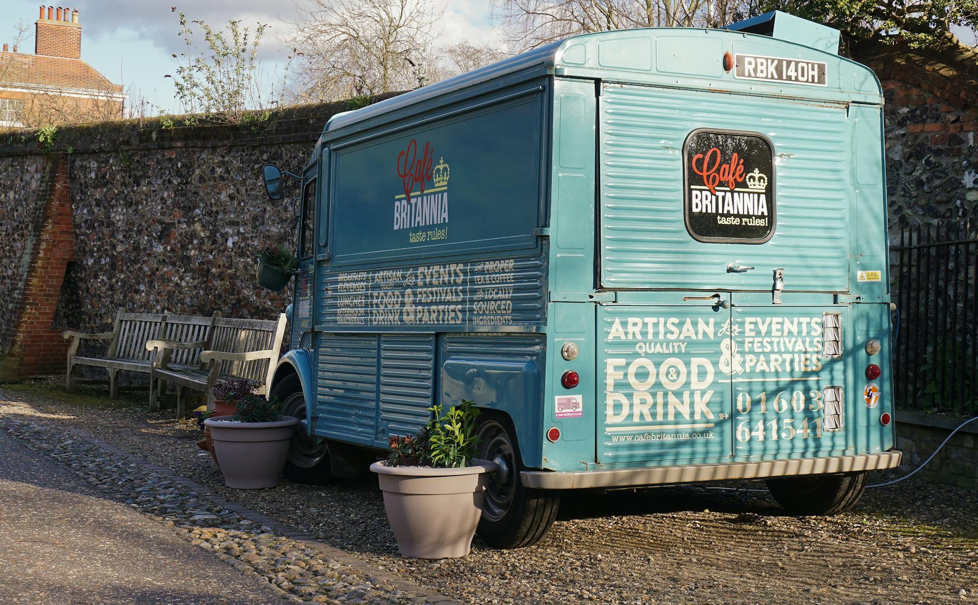 Blue Cafe Britannia food truck parked outdoors, ideal for events and festivals.