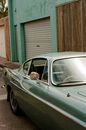 Old fashioned car parked on street