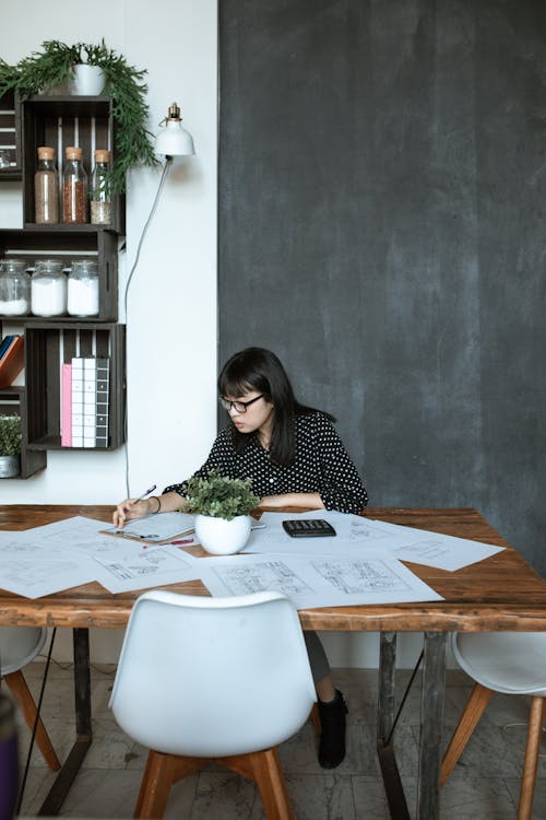 Photo Of Woman Working On Desk 