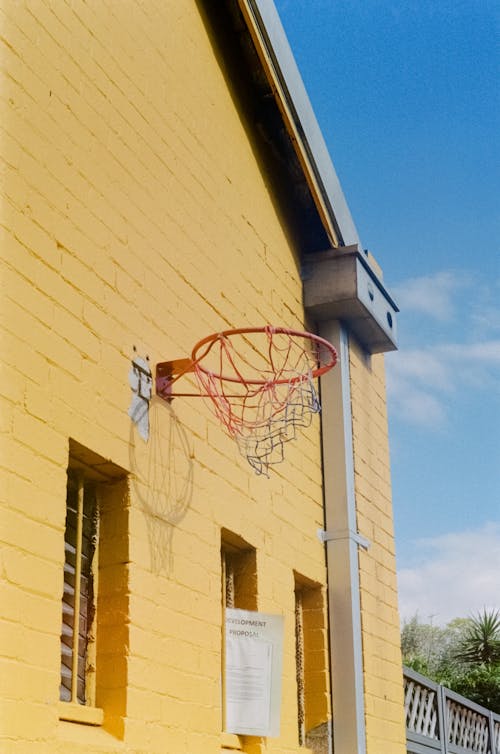 Free Basketball Hoop On  Beige Concrete Wall Stock Photo