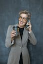 Woman in Gray Blazer Holding Black Ceramic Mug