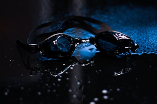 Black Goggles on Wet Surface