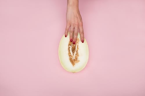 Free Person Holding a Sliced Melon Stock Photo