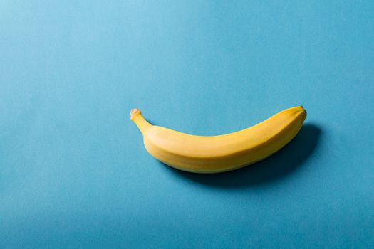 Fresh Banana on Blue Surface
