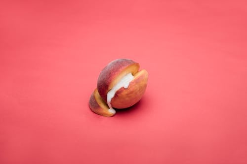 White Liquid Flowing Out of a Peach