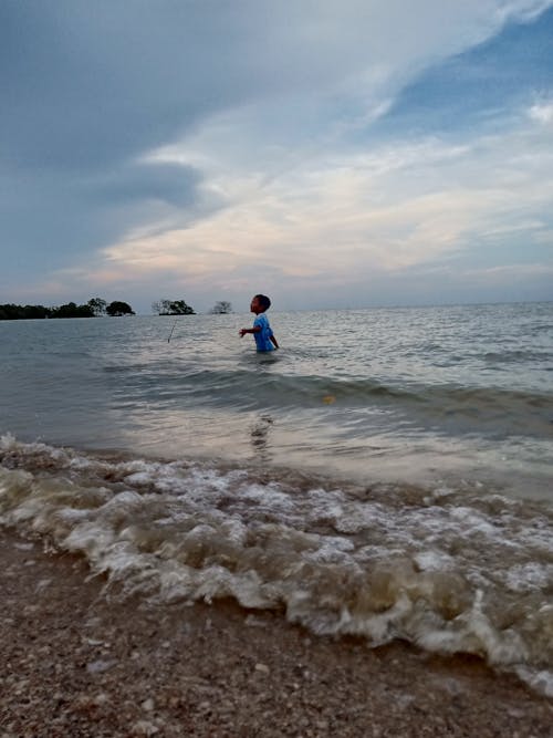 Free stock photo of beach, child, playing on the water