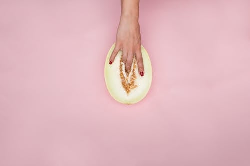 Free Person Holding a Sliced Melon Stock Photo
