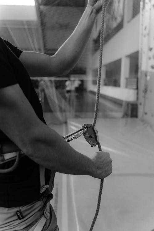 Person in Black T-shirt Holding a Rope