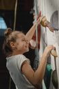 Photo of a Girl Striving to Climb