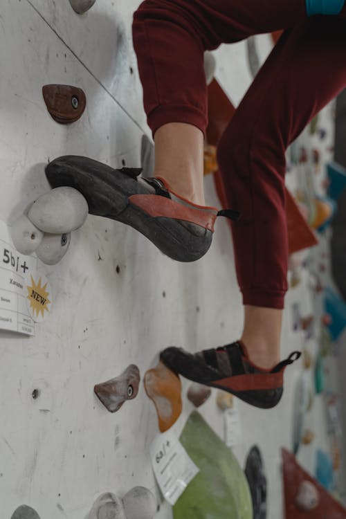 A Person Wearing Climbing Shoes