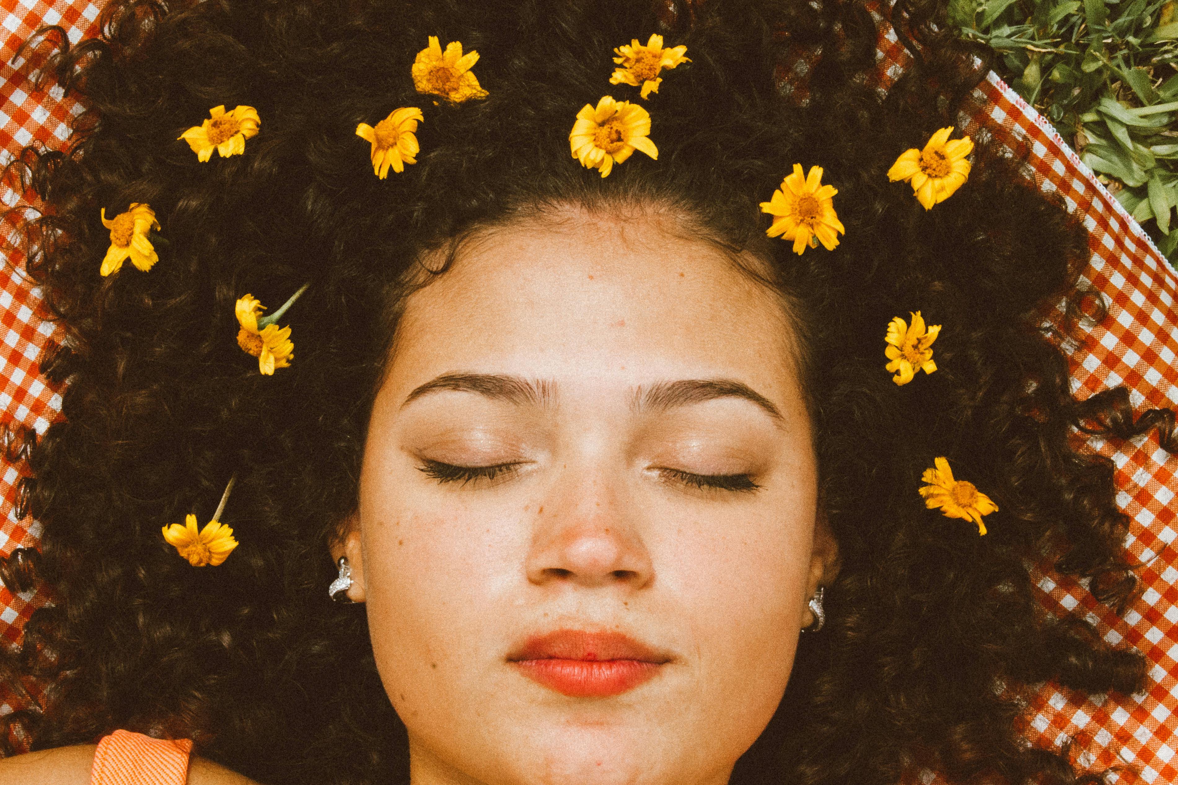 Woman With Flowers on Her Hair · Free Stock Photo