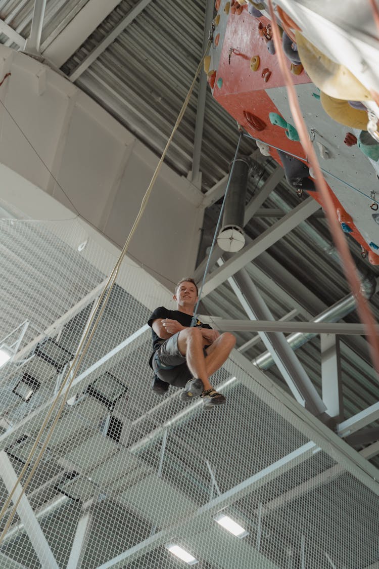 A Man Hanging From A Rope