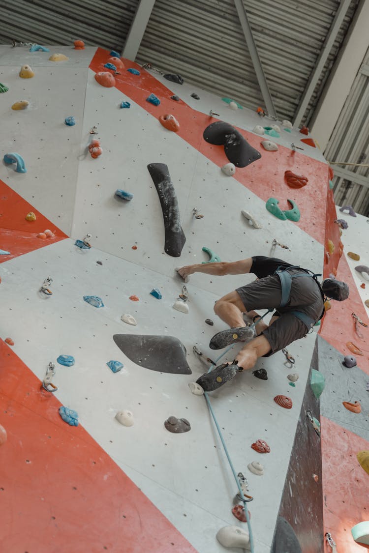 Man Climbing A Climbing Wall