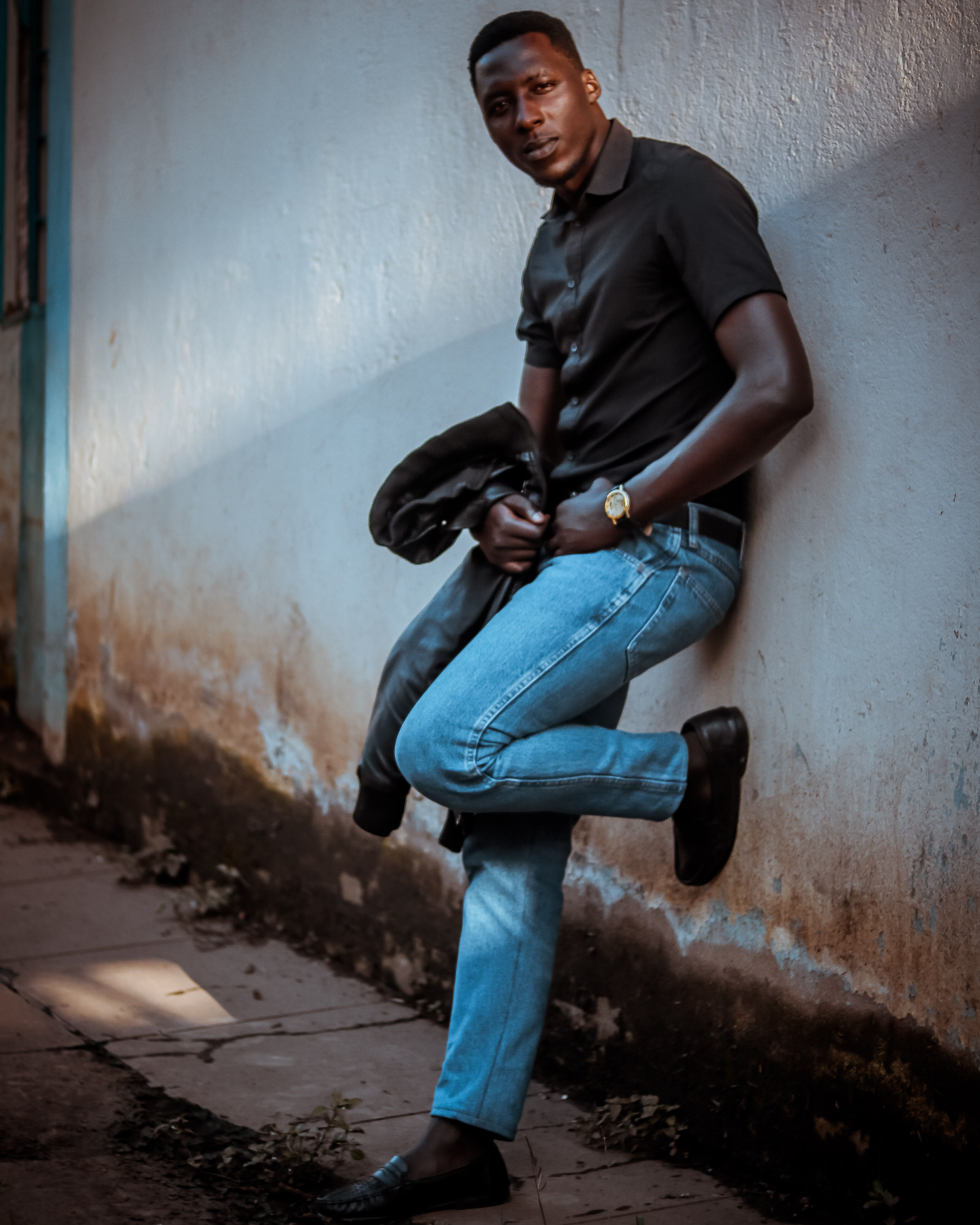 Portrait of a Man Leaning on the Wall · Free Stock Photo