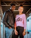 Woman in Pink Shirt and Black Leather Jacket Standing Beside Man in Black Leather Jacket