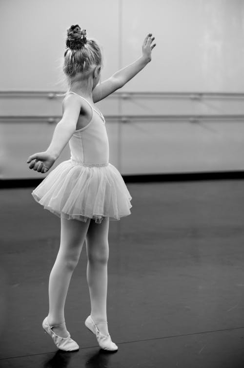 Free Grayscale Photography of Girl Doing Ballet Stock Photo